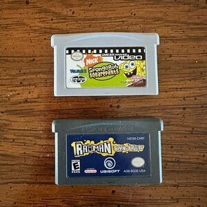 2 Nintendo 2DS Games: SpongeBob SquarePants Vol 2 and Rayman Raving Rabbids.